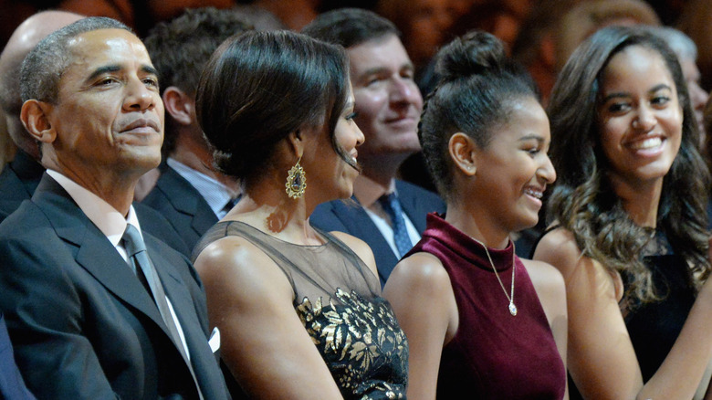 Barack, Michelle, Sasha, and Malia Obama sitting