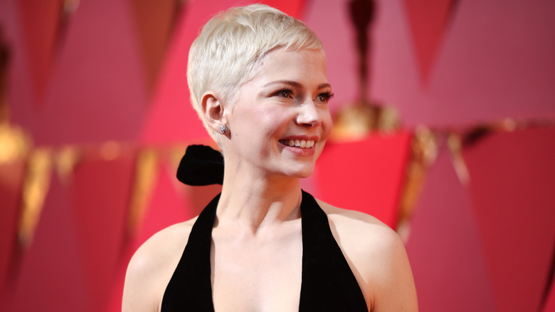 Michelle Williams smiling on the red carpet