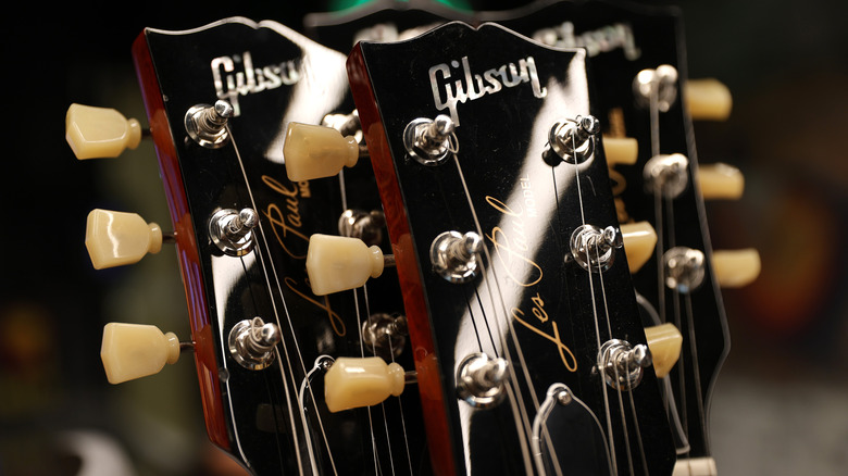 closeup photo of two guitars