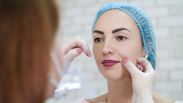 Woman getting lip lift consultation