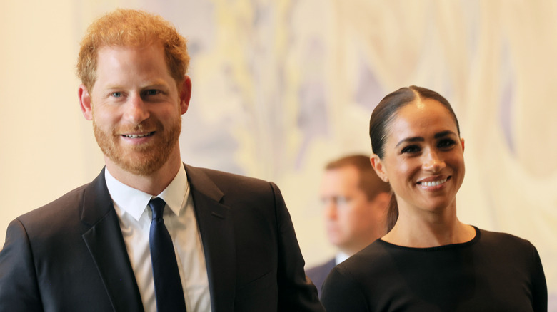 Prince Harry & Meghan Markle smiling