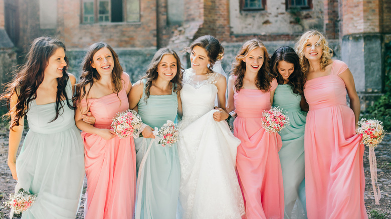 Bridesmaids posing with bride