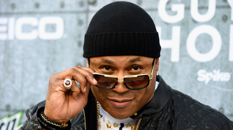 LL Cool J looks over his sunglasses