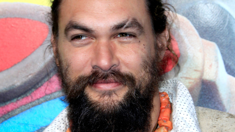 Jason Momoa with hair pulled back