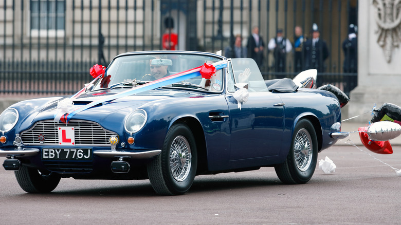 Prince William driving his father's Aston Martin on his wedding day