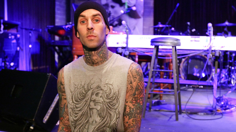 Travis Barker posing at press event