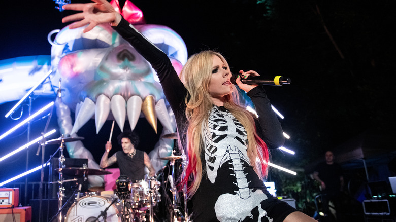 Travis Barker performing with Avril Lavigne