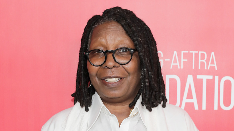 Whoopi Goldberg poses on the red carpet