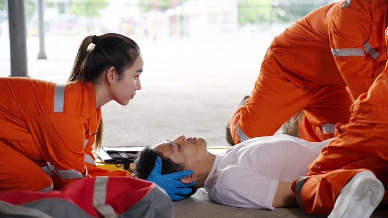 EMTs helping a patient