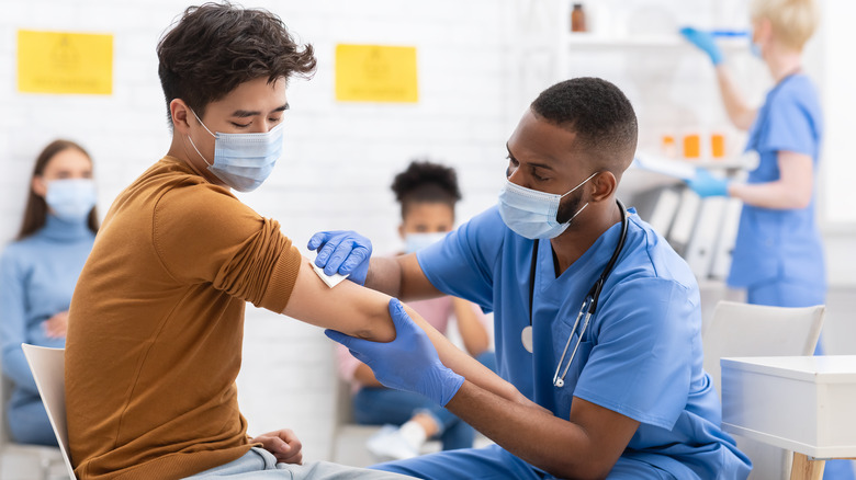 nurse giving a vaccine