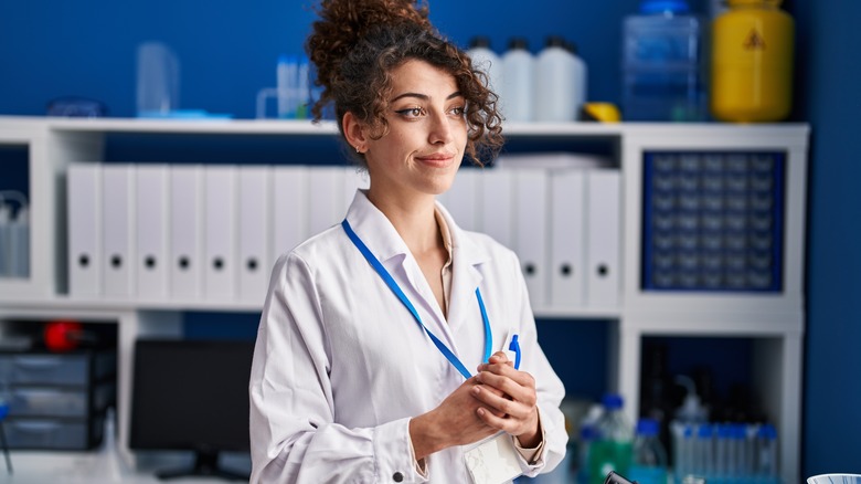 Young Hispanic woman working as pharmacist