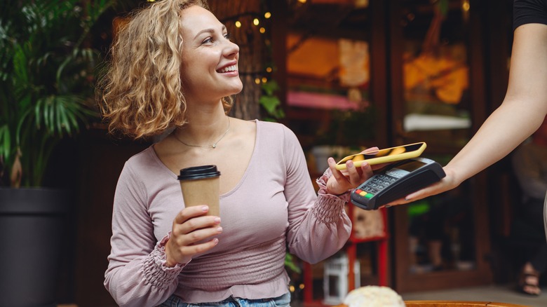 Woman tips waitstaff