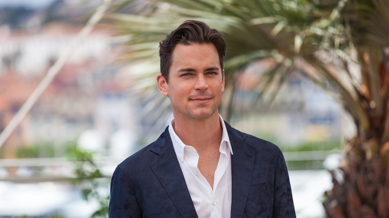 Matt Bomer smiling outdoors