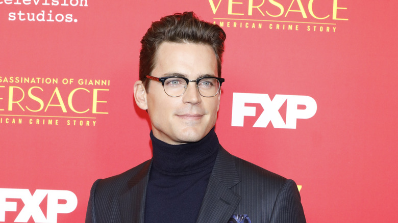 Matt Bomer posing, wearing glasses 