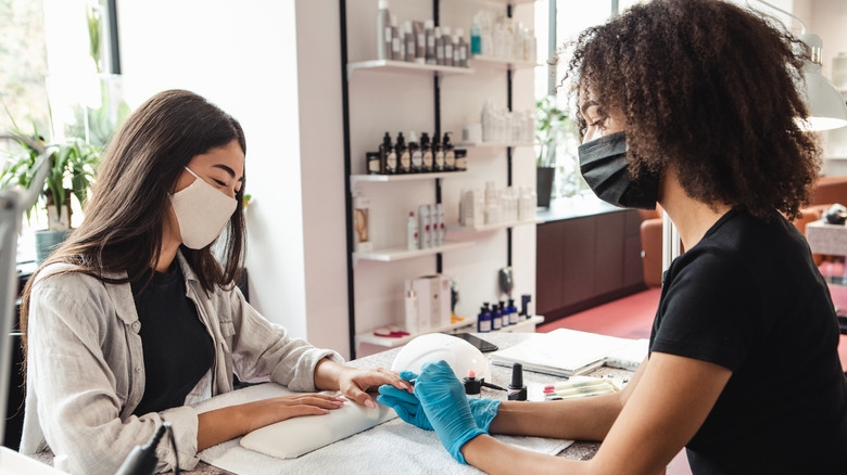 customer receiving simple manicure 