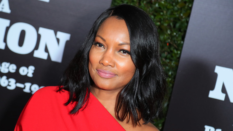 Garcelle Beauvais smiles at an event