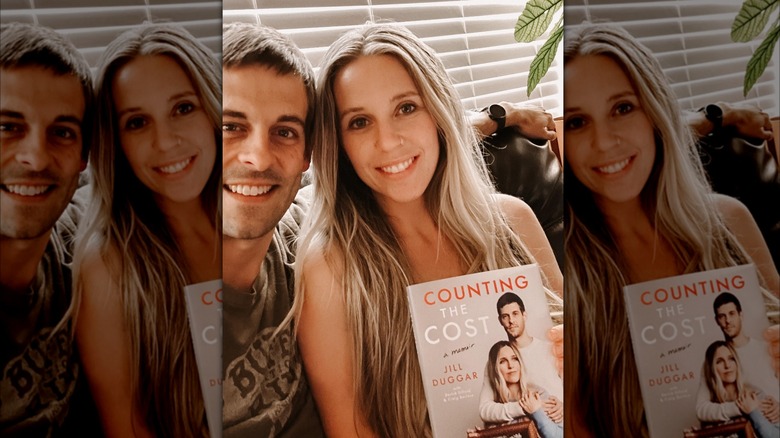 Derek and Jill Dillard posing with the memoir "Counting the Cost"