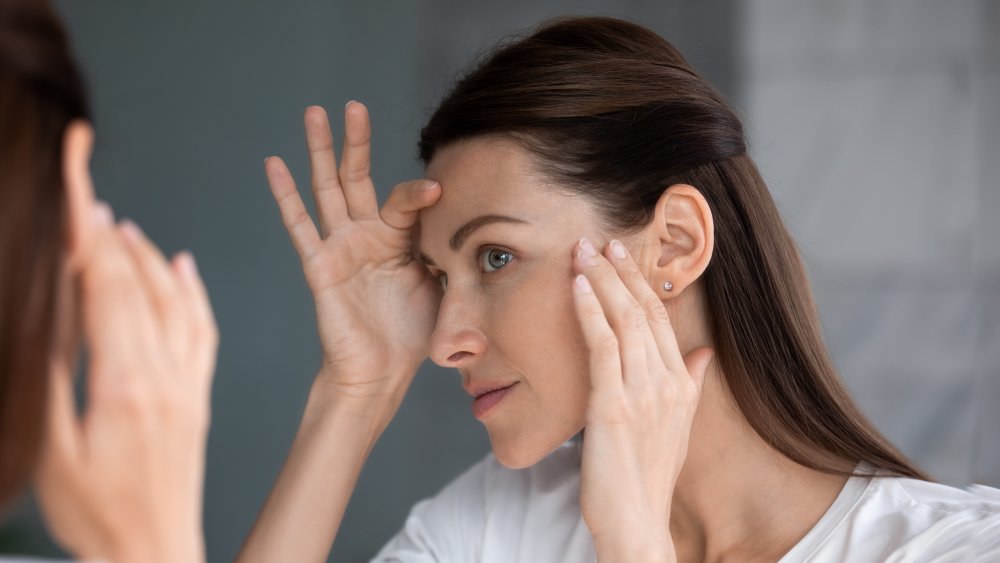 Woman looking in the mirror