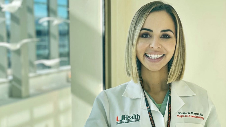 Nicole Martin smiling in hospital jacket