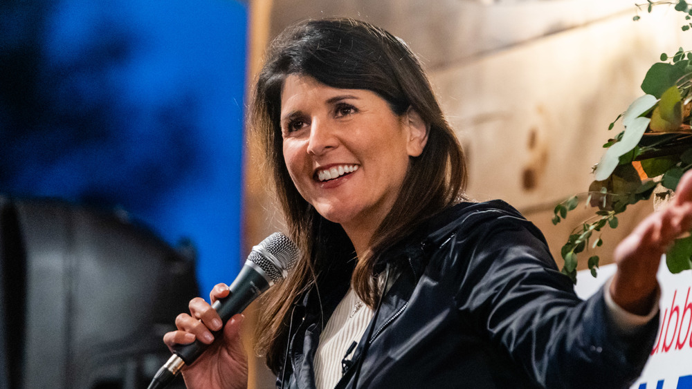 Nikki Haley smiling while speaking at an event in blue blazer