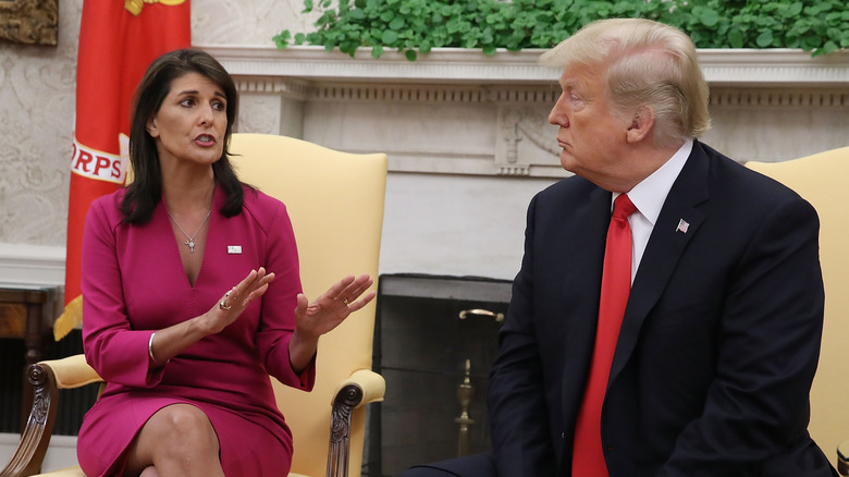 nikki haley sits opposite donald trump