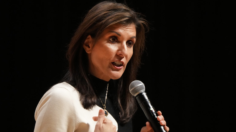 Nikki Haley pointing to herself while talking into a microphone