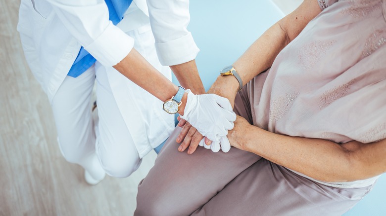 Doctor comforts female patient