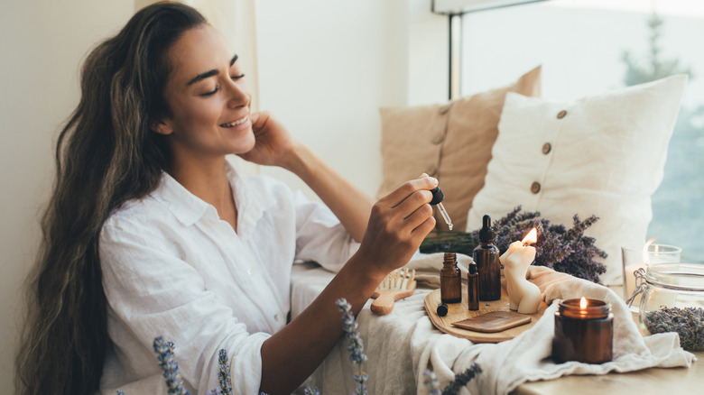 woman holding tincture