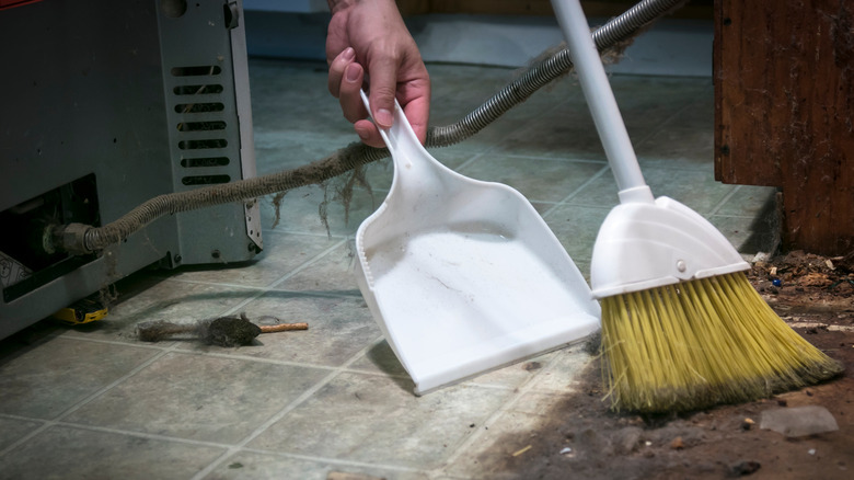 Sweeping under refrigerator