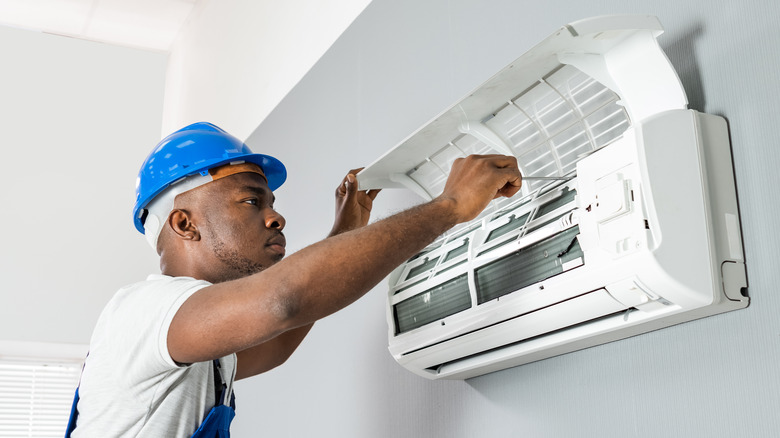 Professional working on AC unit