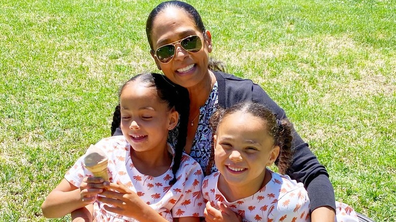 Maya Harris smiling with her grandchildren