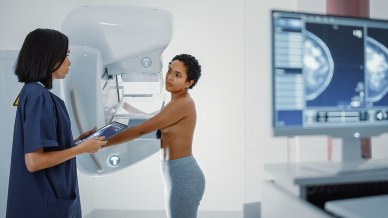 short haired woman getting mammogram