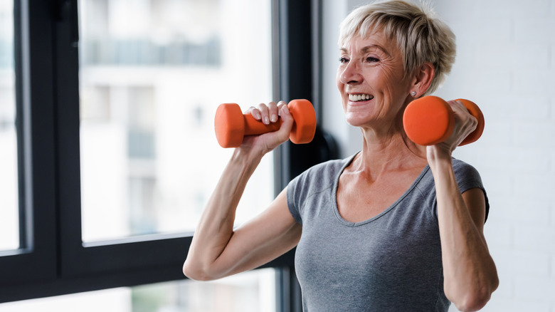 Older woman lifting weights