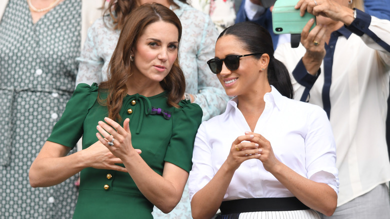 Kate Middleton and Meghan Markle smiling 