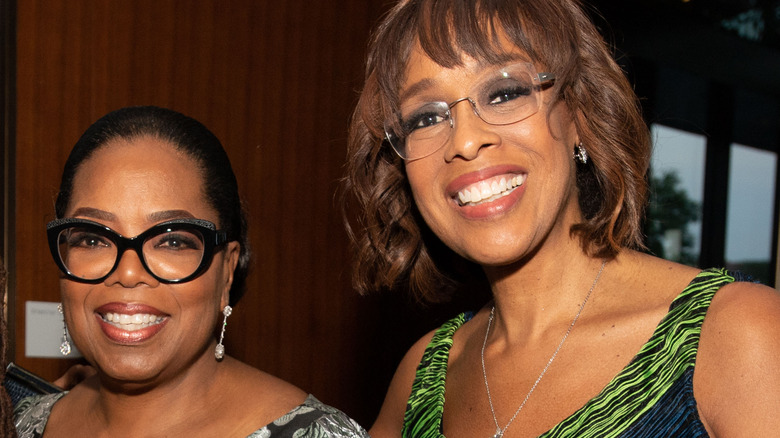 Gayle King and Oprah Winfrey posing 