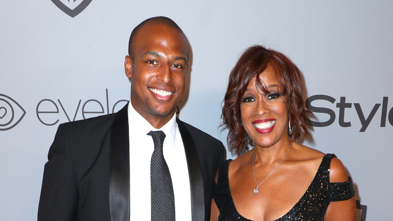 Gayle King and William Bumpus on a red carpet 