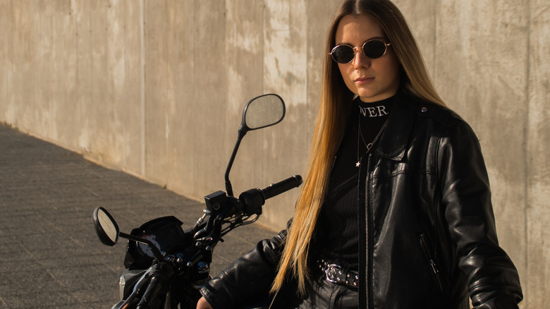 Girl in black with motorcycle