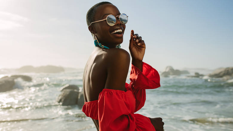 Woman in red on beach