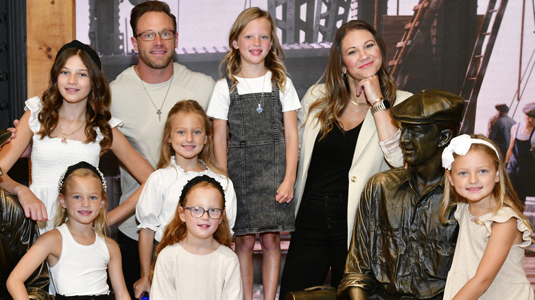 Adam and Danielle Busby pose with their daughters