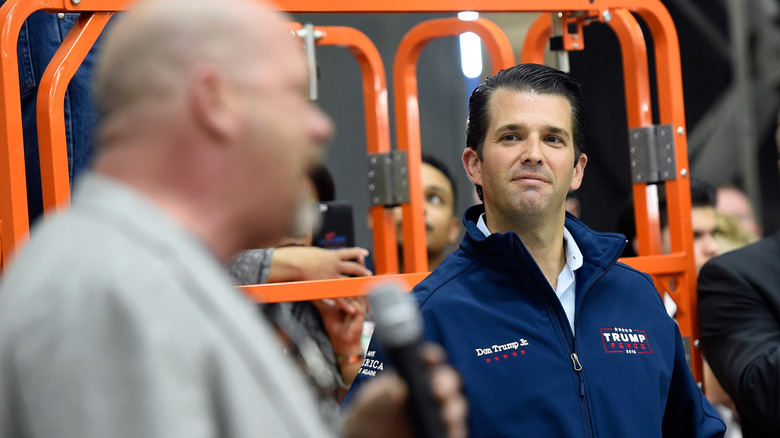 Donald Trump Jr. looks on while Rick Harrison speaks