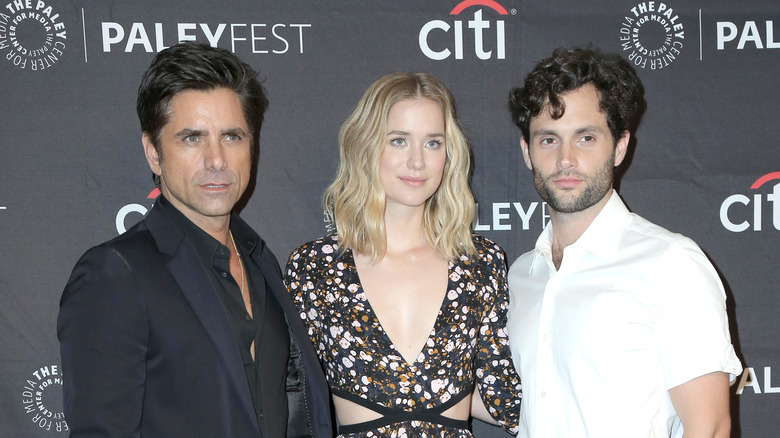 Penn Badgley poses with his season one "You" co-stars