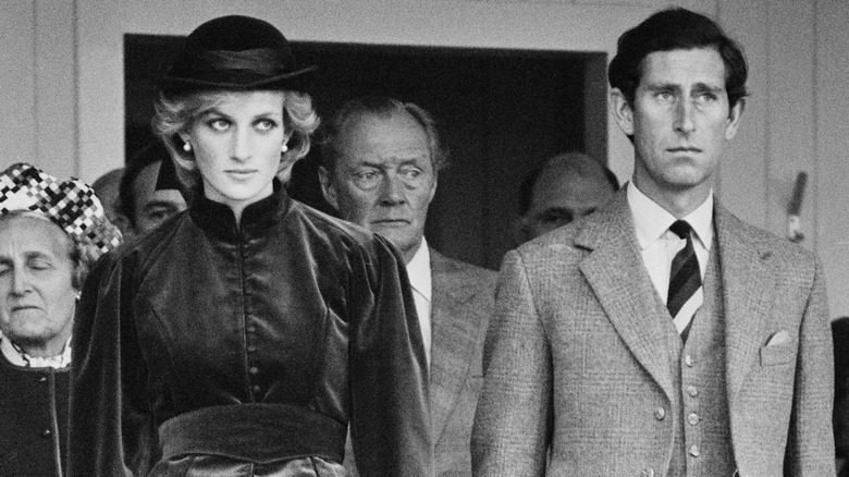 Prince Charles and Princess Diana looking serious