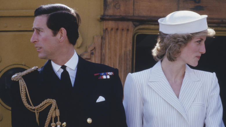 Prince Charles and Princess Diana looking away from each other