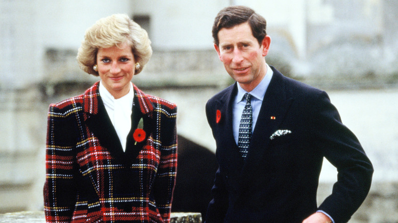 Prince Charles and Princess Diana in front of a building