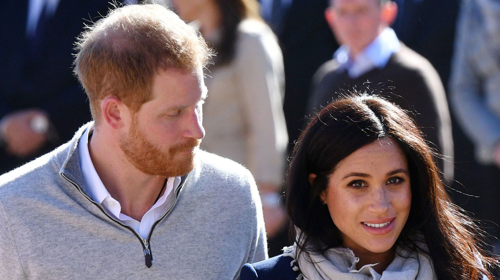 Prince Harry and Meghan Markle at outdoor event