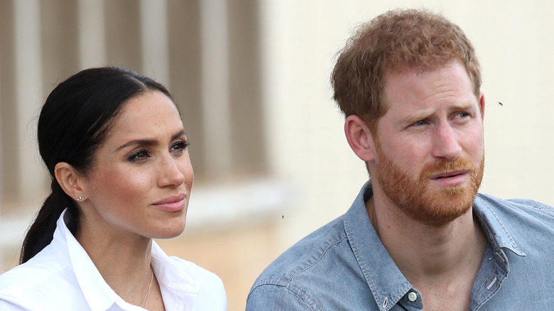 Meghan Markle and Prince Harry listening 