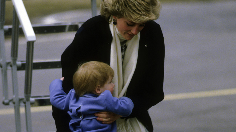 Princess Diana picking Harry up