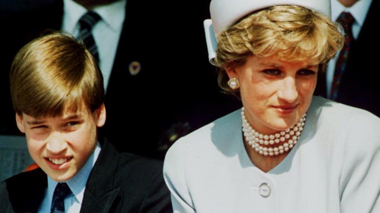 Prince William sitting with Princess Diana