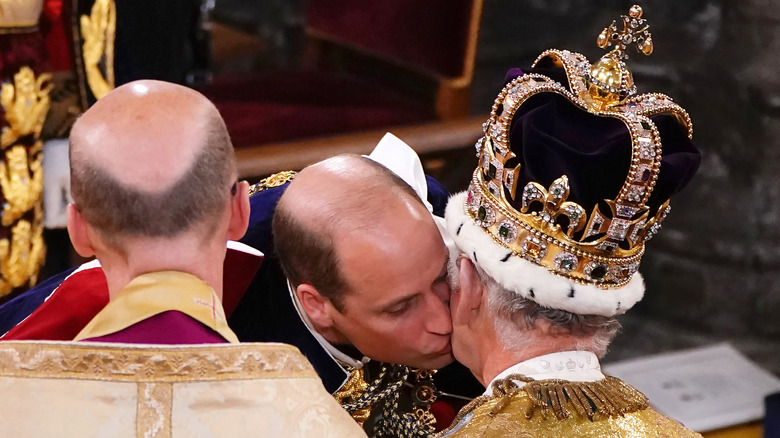 Prince William kissing King Charles on the cheek during the coronation