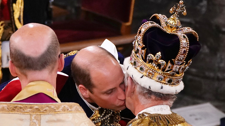 Prince William kissing King Charles at coronation